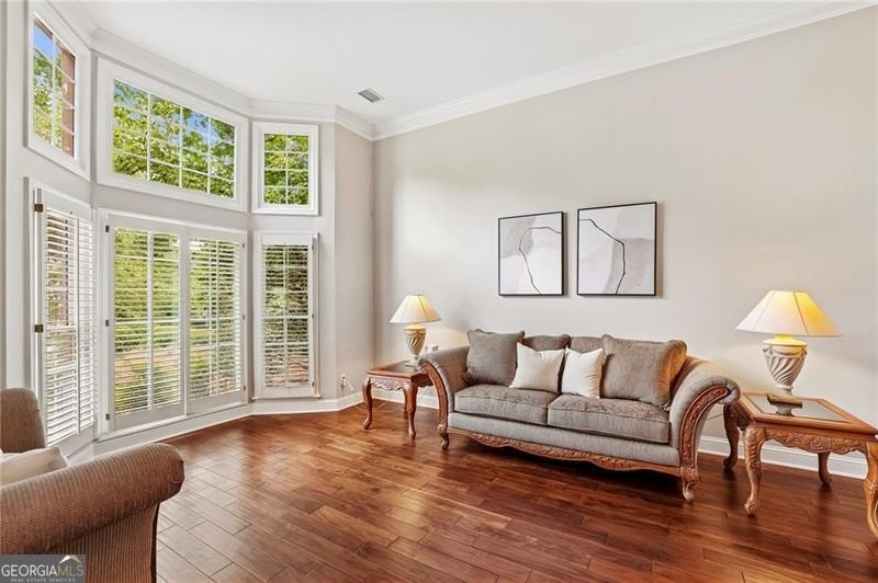 Welcome home to 6930 Olde Atlanta Parkway, where refined living - photo 11