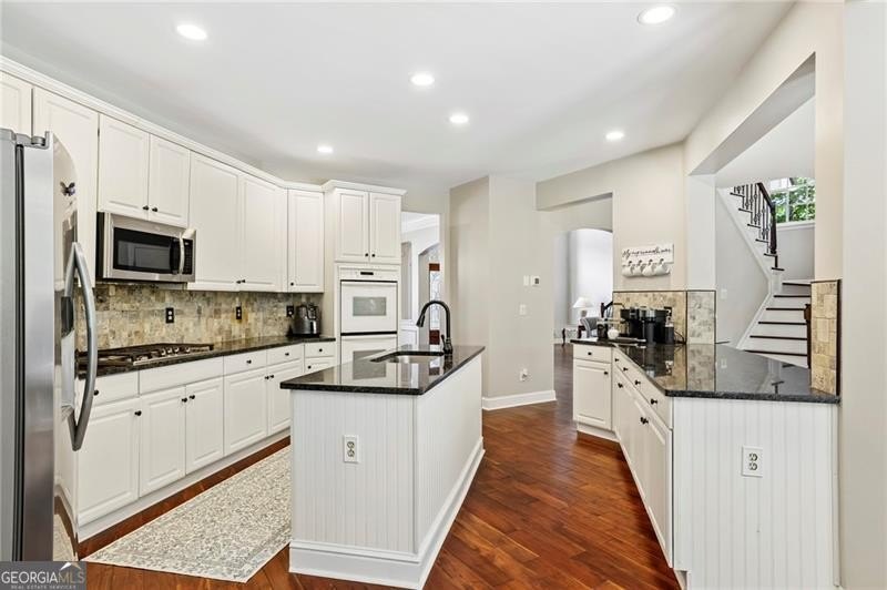 Welcome home to 6930 Olde Atlanta Parkway, where refined living - photo 20