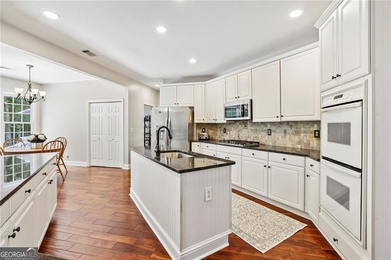 Welcome home to 6930 Olde Atlanta Parkway, where refined living - photo 22