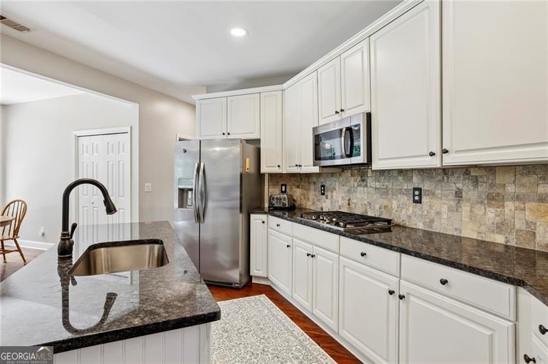 Welcome home to 6930 Olde Atlanta Parkway, where refined living - photo 23