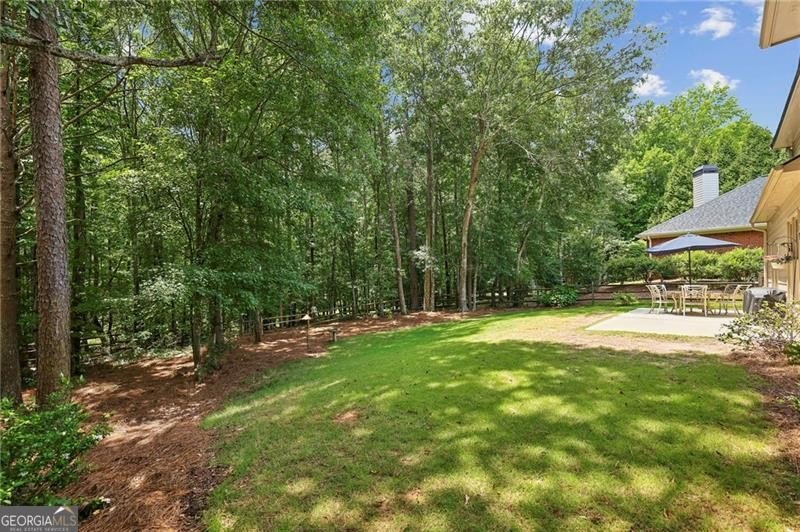 Welcome home to 6930 Olde Atlanta Parkway, where refined living - photo 42