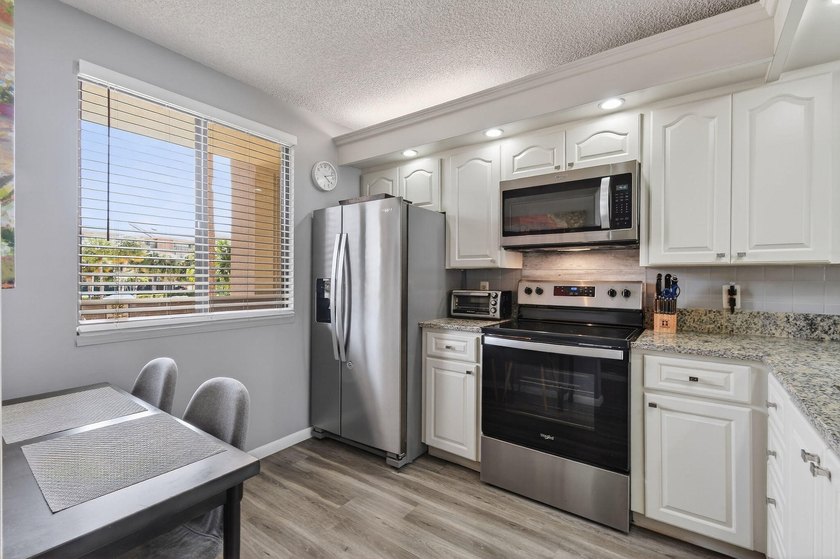 Enjoy spectacular marina views from your living room, kitchen - photo 6