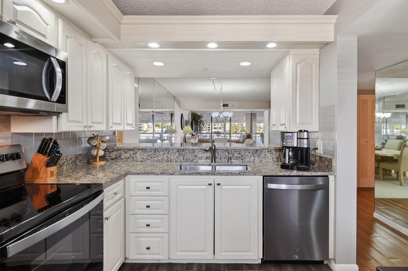 Enjoy spectacular marina views from your living room, kitchen - photo 7