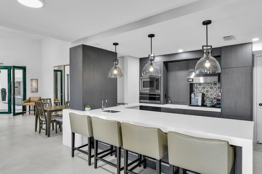 Best Waterfront Value in Mizner Village! Discover one of the - photo 39