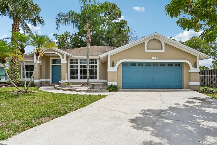 Tucked away in a private setting, this charming 3-bedroom - photo 2