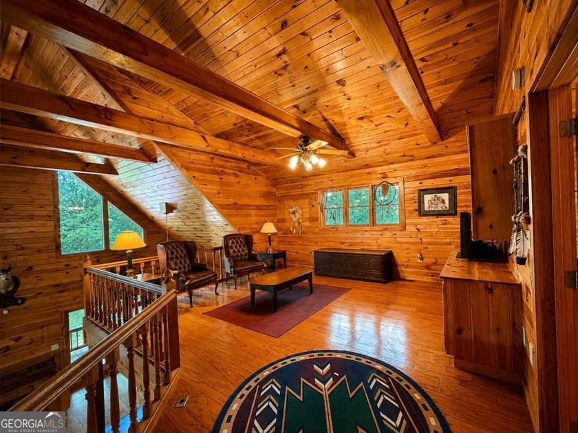 Tucked into a private wooded setting on top of the mountain in - photo 11
