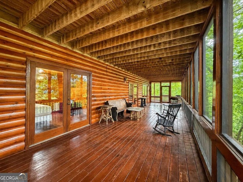 Tucked into a private wooded setting on top of the mountain in - photo 12