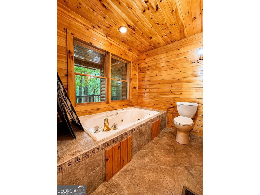 Tucked into a private wooded setting on top of the mountain in - photo 16