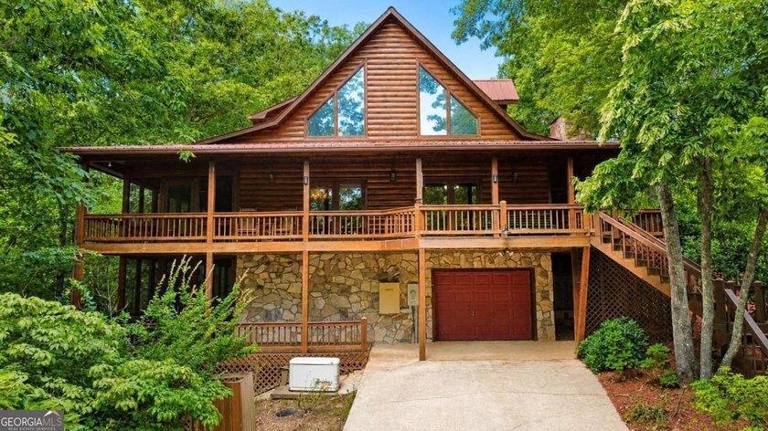 Tucked into a private wooded setting on top of the mountain in - photo 19