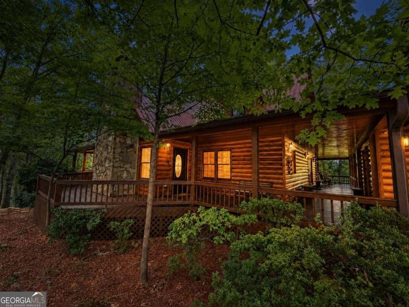 Tucked into a private wooded setting on top of the mountain in - photo 26