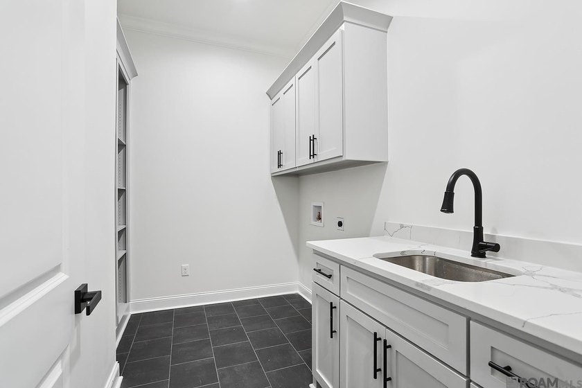 Welcome to this beautifully designed 4-bedroom, 3-bath home in - photo 13