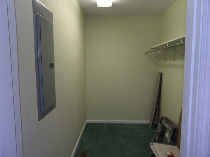 Well-maintained property featuring a 14' RV carport with hookups - photo 20
