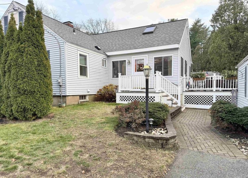 This beautifully maintained 3-bedroom, 2-bath Cape offers - photo 3