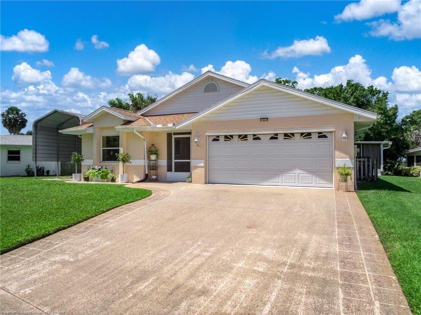 Immaculate Waterfront Living with Direct Lake Access! Nestled on - photo 2