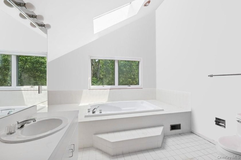 Tucked away on 1.4 acres of lush, landscaped grounds, this - photo 12