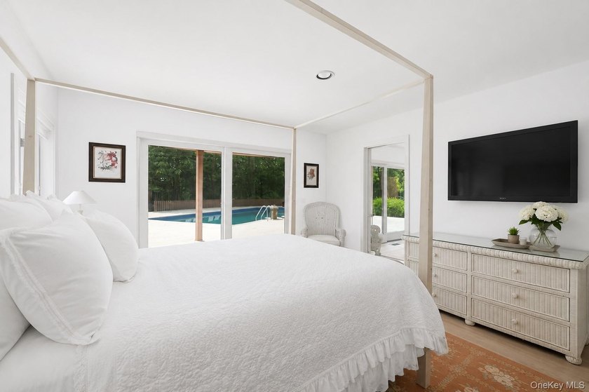 Tucked away on 1.4 acres of lush, landscaped grounds, this - photo 16