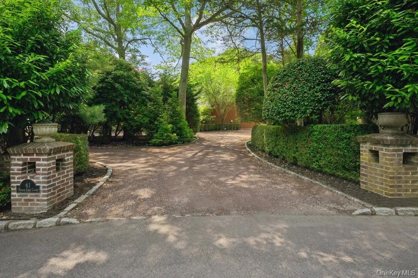 Tucked away on 1.4 acres of lush, landscaped grounds, this - photo 22