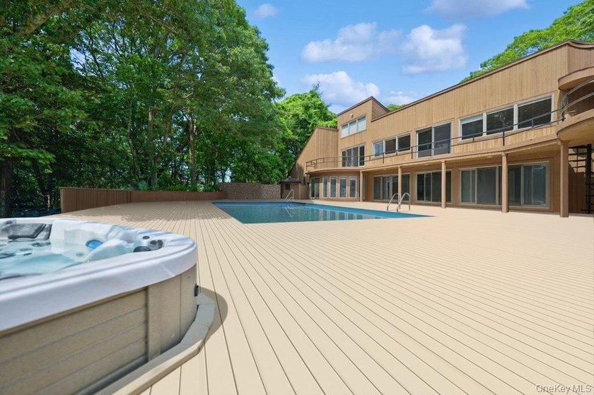 Tucked away on 1.4 acres of lush, landscaped grounds, this - photo 24