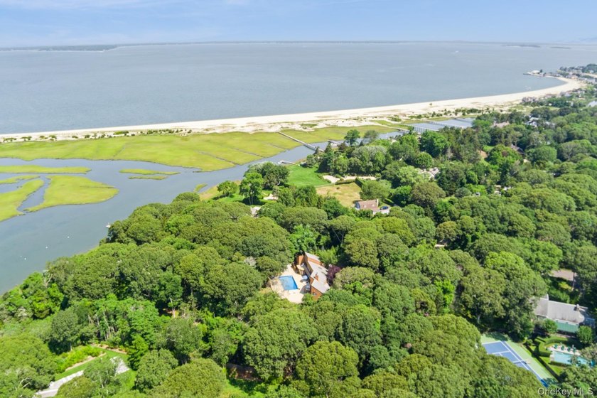 Tucked away on 1.4 acres of lush, landscaped grounds, this - photo 28