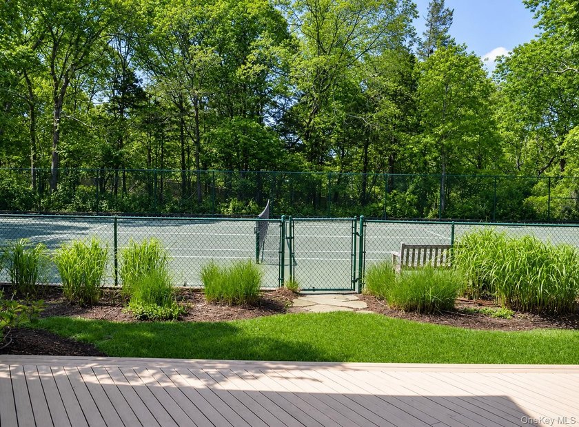 Tucked away on 1.4 acres of lush, landscaped grounds, this - photo 29