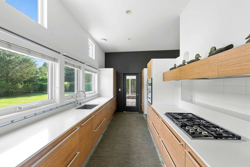 Located on a quiet lane in the heart of Sagaponack Village, this - photo 12