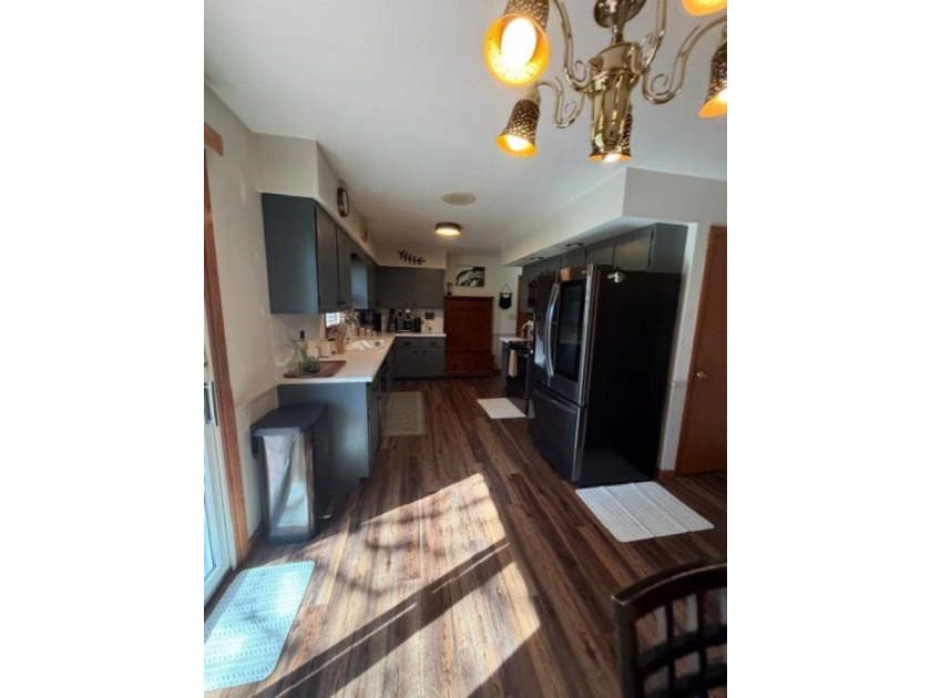 This home features a 2-car attached garage and a thoughtfully - photo 13