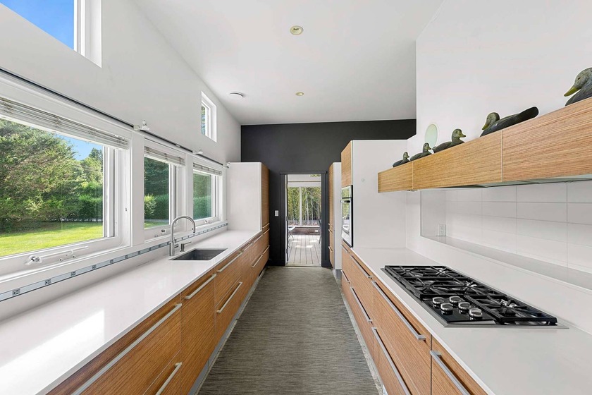 Located on a quiet lane in the heart of Sagaponack Village, this - photo 13