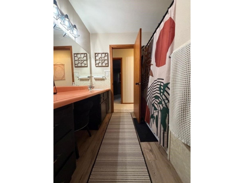 This home features a 2-car attached garage and a thoughtfully - photo 17