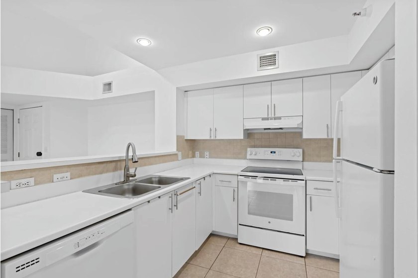 Welcome to this waterfront condominium situated in Yacht Club on - photo 15