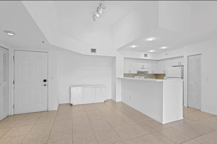 Welcome to this waterfront condominium situated in Yacht Club on - photo 17