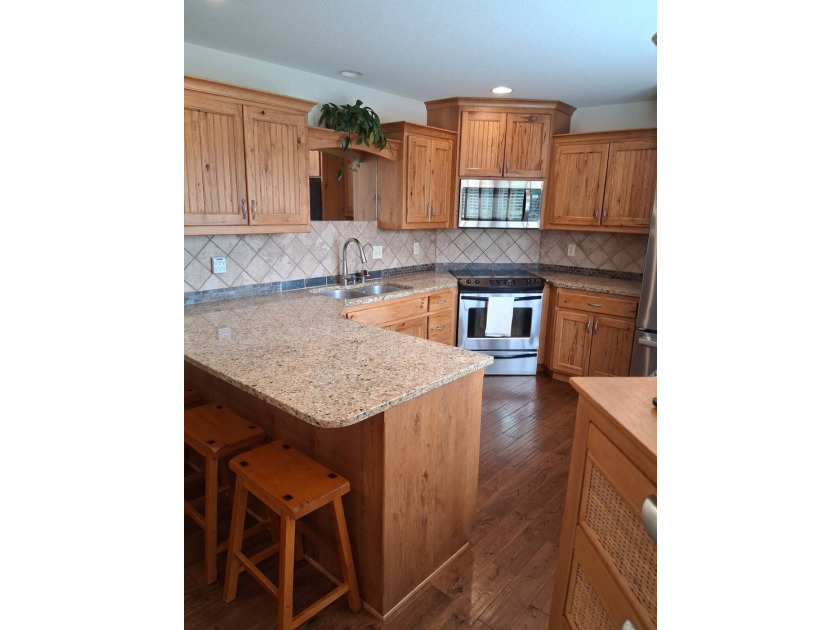 Nestled into a quiet cove, this 1 1/2 story home offers 3 - photo 13