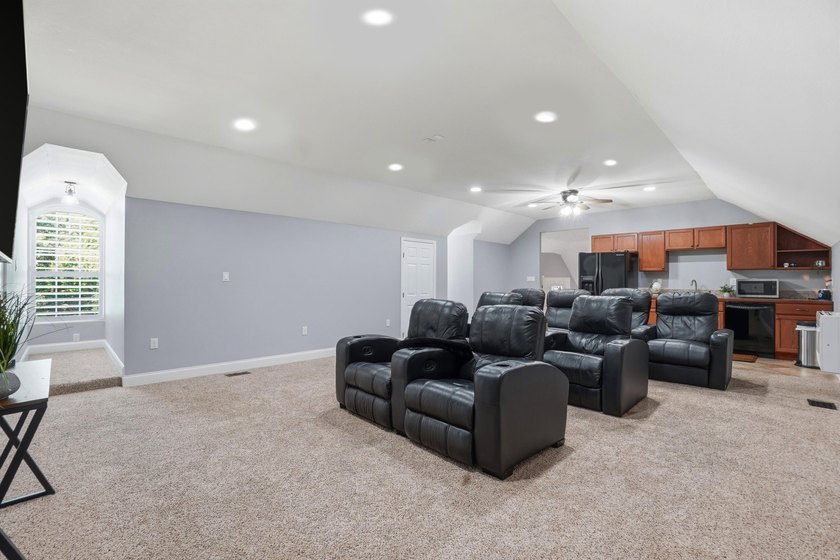 Movie theater? Covered heated pool? This stunning 5 bed, 4 bath - photo 36