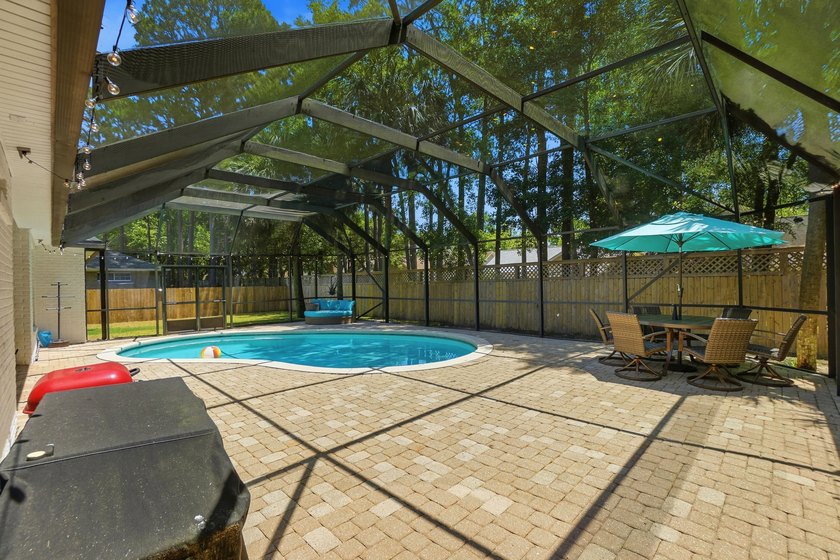 Movie theater? Covered heated pool? This stunning 5 bed, 4 bath - photo 44