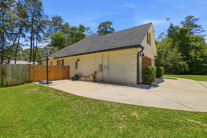 Movie theater? Covered heated pool? This stunning 5 bed, 4 bath - photo 48