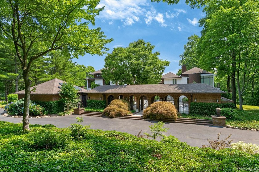 Perched above Oyster Bay Harbor on 4.04 private acres in the - photo 2