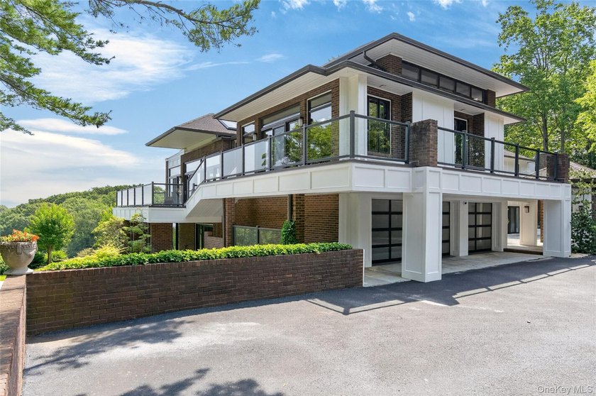 Perched above Oyster Bay Harbor on 4.04 private acres in the - photo 4