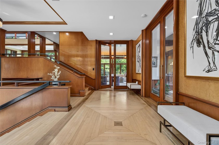Perched above Oyster Bay Harbor on 4.04 private acres in the - photo 7