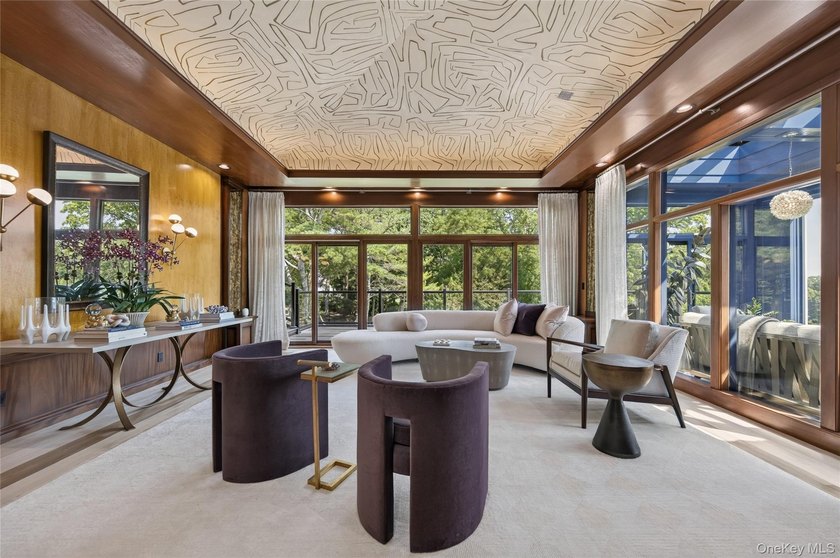 Perched above Oyster Bay Harbor on 4.04 private acres in the - photo 8