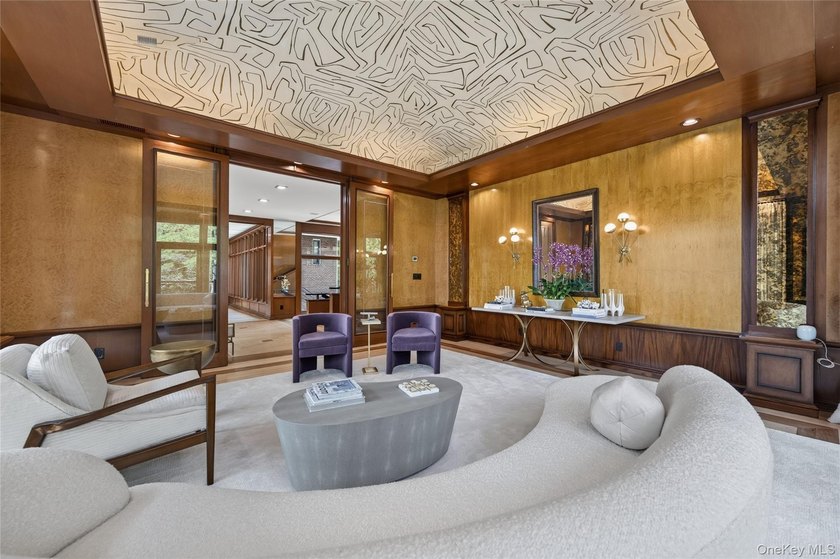Perched above Oyster Bay Harbor on 4.04 private acres in the - photo 9