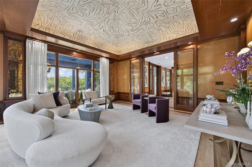 Perched above Oyster Bay Harbor on 4.04 private acres in the - photo 10