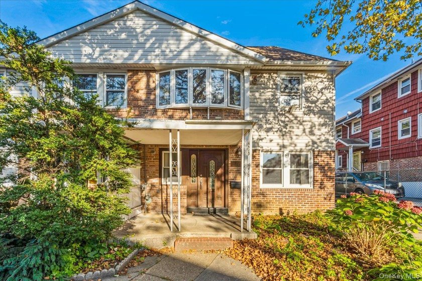 Welcome to Charming Two-Family Home in Prime Oakland Gardens, a - photo 3