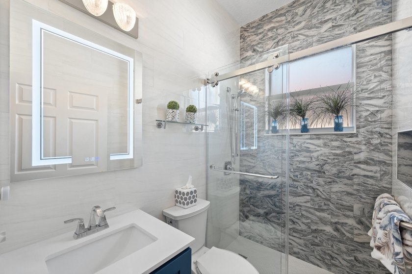 Welcome to this single-story waterfront residence in the - photo 27