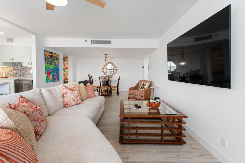 Experience elevated coastal living in this immaculate, fully - photo 12