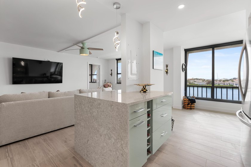 Experience elevated coastal living in this immaculate, fully - photo 14