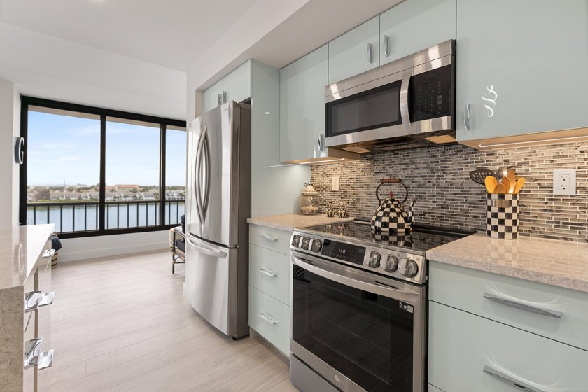 Experience elevated coastal living in this immaculate, fully - photo 16