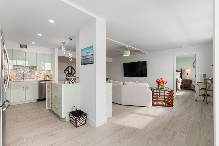 Experience elevated coastal living in this immaculate, fully - photo 21