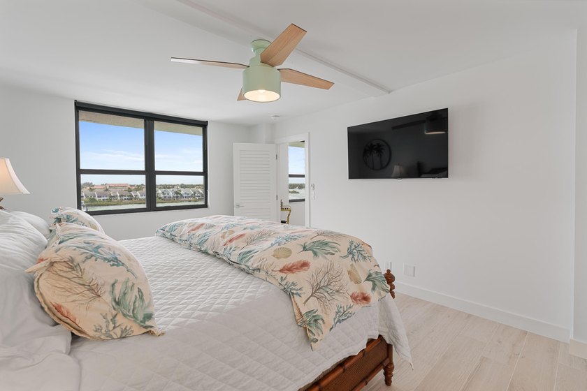 Experience elevated coastal living in this immaculate, fully - photo 25