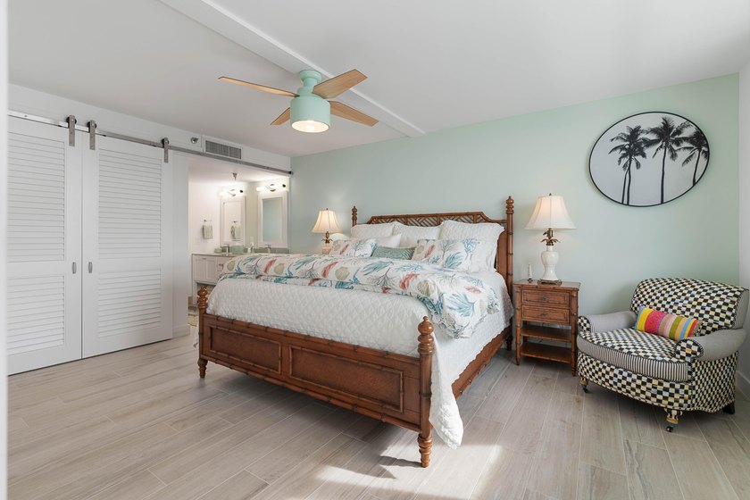 Experience elevated coastal living in this immaculate, fully - photo 26