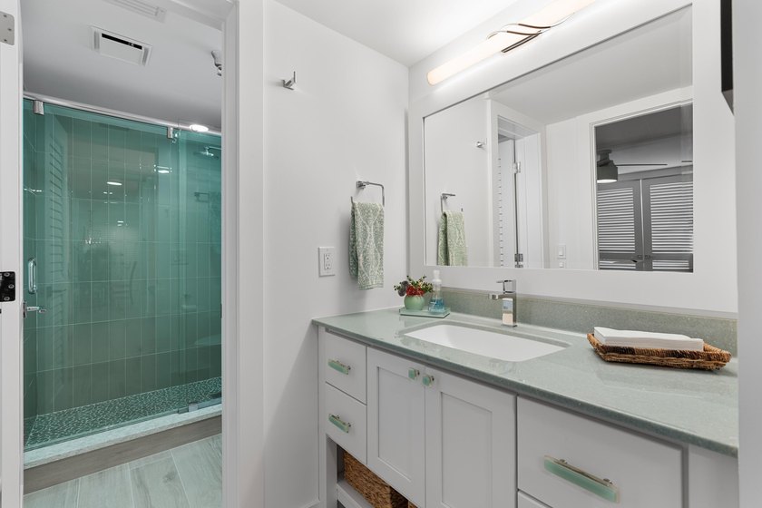 Experience elevated coastal living in this immaculate, fully - photo 30