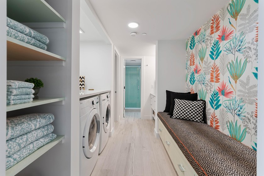 Experience elevated coastal living in this immaculate, fully - photo 37